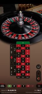 Live roulette game action on mobile screen.