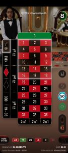 Live Roulette game interface with roulette table and dealer on mobile screen.